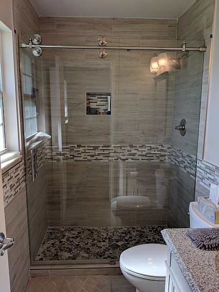 sliding glass shower door and wall