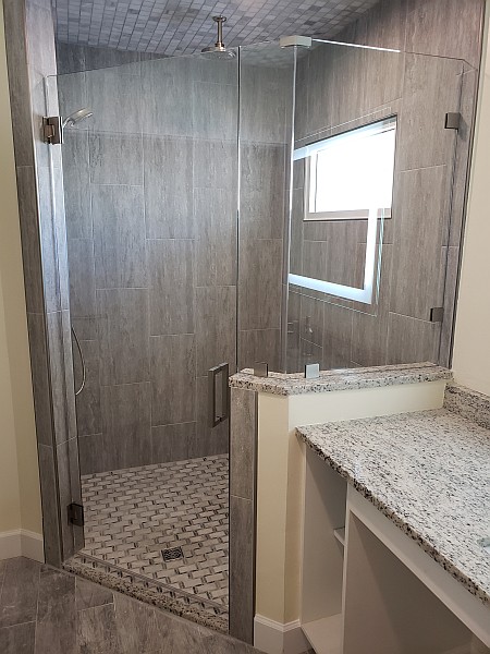 glass shower door and half wall